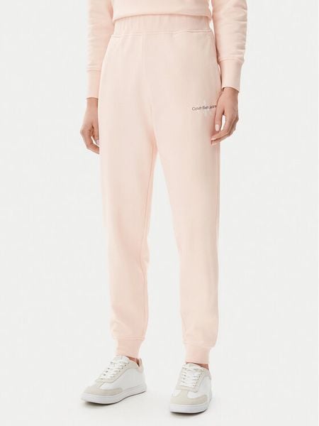Calvin Klein Jeans Spodnie dresowe Monologo J20J225354 Różowy Slim Fit. Czerwone jeansy damskie Calvin Klein Jeans. Za 219.99 zł.
