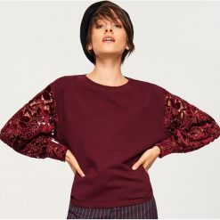 Bluza z ażurowymi rękawami - Bordowy. Bluzy damskie marki KALENJI. W wyprzedaży za 69.99 zł.