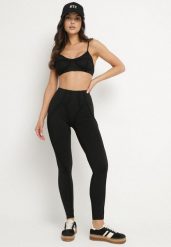 Czarny Komplet Sportowy z Ozdobnymi Przeszyciami Legginsy i Top na Ramiączkach Filinella. Czarne legginsy damskie Born2be, m, bez wzorów, na fitness i siłownię. Za 84.99 zł.