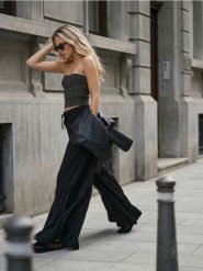 Szerokie spodnie z falbanami i wiązaniem w talii z wiskozą - czarny. Czarne spodnie materiałowe damskie Sinsay, l, bez wzorów, z wiskozy. Za 59.99 zł.