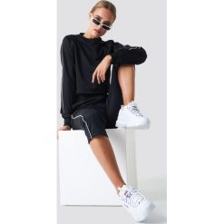 NA-KD Spodnie sportowe - Black. Czarne spodnie sportowe damskie NA-KD, z poliesteru. Za 141.95 zł.