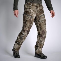 Spodnie myśliwskie Solognac Warm 900 camo treemetic wodoodporne. Brązowe spodnie sportowe męskie SOLOGNAC, m, bez wzorów, z materiału, outdoorowe. Za 499.99 zł.