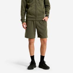 Spodenki fitness męskie Domyos Essentials. Zielone krótkie spodenki sportowe męskie DOMYOS, l, bez wzorów, z materiału, na fitness i siłownię. Za 49.99 zł.