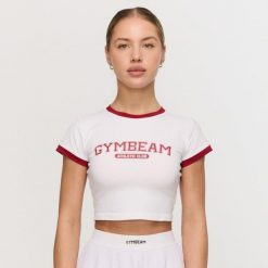 Koszulka damska fitness slim biała Varsity. Białe koszulki sportowe damskie GYMBEAM, l, bez wzorów, z elastanu, bez kołnierzyka, bez ramiączek, na fitness i siłownię. Za 88.90 zł.