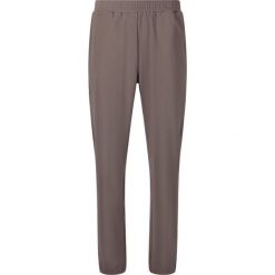 Damskie spodnie dresowe Athlecia Guyana. Brązowe obuwie sportowe damskie Athlecia, bez wzorów, z dresówki, na fitness i siłownię. Za 189.50 zł.