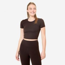 Koszulka do jogi i pilatesu Breathe. Brązowe koszulki sportowe damskie DOMYOS, m, bez wzorów, z elastanu, bez kołnierzyka, bez ramiączek, na fitness i siłownię. W wyprzedaży za 49.99 zł.