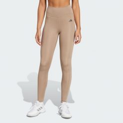 Długie legginsy Optimé Essentials Stash Pocket. Brązowe legginsy damskie Adidas, xs, bez wzorów, z elastanu, z podwyższonym stanem, długie, na fitness i siłownię. Za 200.00 zł.
