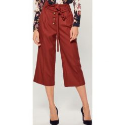 Spodnie culotte z wiązaniem - Bordowy. Spodnie materiałowe damskie marki Mohito. Za 149.99 zł.