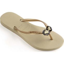 Havaianas - Japonki. Klapki damskie Havaianas, bez wzorów, z materiału, bez obcasa, na płaskiej podeszwie, bez zapięcia. W wyprzedaży za 69.90 zł.