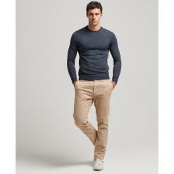 Sweter z wełny merynosów Superdry. Niebieskie swetry przez głowę męskie Superdry., na zimę, l, bez wzorów, z wełny, bez kołnierzyka. Za 342.35 zł.