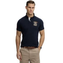 Koszulka polo z logo Superdry. Niebieskie koszulki polo męskie Superdry., m, z aplikacjami, klasyczne, bez ramiączek. Za 275.10 zł.