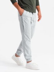 Męskie dzianinowe spodnie joggery z ozdobną plisą – jasnoszare V3 OM-PAJO-0202 - XXL. Szare spodnie materiałowe męskie Ombre Clothing, l, z aplikacjami, z bawełny. Za 149.99 zł.