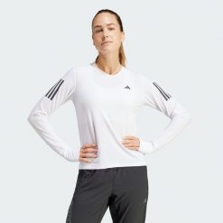 Koszulka Own The Run Long Sleeve. Białe koszulki sportowe damskie Adidas, xs, bez wzorów, z materiału, sportowe, bez kołnierzyka. Za 199.00 zł.