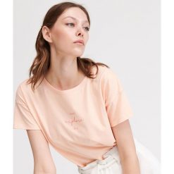 T-shirt z napisem - Pomarańczowy. T-shirty damskie marki Reserved. Za 29.99 zł.