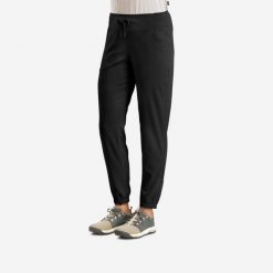 Spodnie turystyczne damskie Quechua NH100. Czarne spodnie sportowe damskie QUECHUA, m, bez wzorów, z materiału, trekkingowe. Za 69.99 zł.