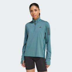 Kurtka Own the Run Half-Zip. Niebieskie bluzy sportowe damskie Adidas, xs, bez wzorów, z materiału, bez kaptura. W wyprzedaży za 164.25 zł.