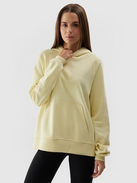 4F Bluza dresowa nierozpinana z kapturem damska - żółta S. Żółte bluzy sportowe damskie 4f, l, bez wzorów, z bawełny, sportowe, bez kołnierzyka, bez ramiączek, z kapturem. W wyprzedaży za 79.99 zł.