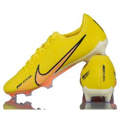 Korki do gry w piłkę Nike Zoom Vapor 15 Academy na trawę. Żółte buty sportowe męskie Nike, bez zapięcia, do piłki nożnej, nike zoom. Za 297.40 zł.