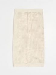 Ażurowa spódnica plażowa - kremowy. Białe spódnice damskie Sinsay, l, w ażurowe wzory. Za 49.99 zł.