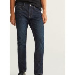 Jeansy slim fit z ociepleniem - Granatowy. Niebieskie jeansy męskie Reserved. Za 149.99 zł.