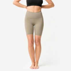 Legginsy krótkie do jogi i pilatesu Domyos. Brązowe legginsy damskie DOMYOS, s, bez wzorów, z elastanu, sportowe, na fitness i siłownię. Za 69.99 zł.