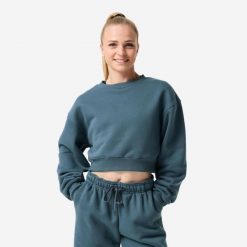 Bluza fitness damska Domyos crop. Niebieskie bluzy sportowe damskie DOMYOS, l, bez wzorów, z bawełny, bez kaptura, na fitness i siłownię. Za 129.99 zł.