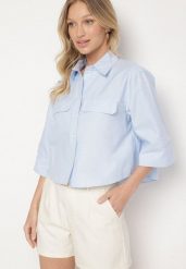 Jasnoniebieska Bawełniana Koszula z Ozdobnymi Klapami Tilorelle. Niebieskie bluzki damskie Born2be, l, z aplikacjami, z bawełny, eleganckie, bez kołnierzyka, bez ramiączek. Za 89.99 zł.