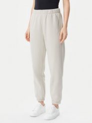 Gap Spodnie dresowe 765568-03 Beżowy Relaxed Fit. Brązowe spodnie dresowe damskie GAP, l, bez wzorów, z bawełny. Za 149.99 zł.