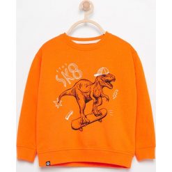 Bluza z nadrukiem dinozaura - Pomarańczo. Bluzy dla chłopców Reserved, z nadrukiem. W wyprzedaży za 14.99 zł.