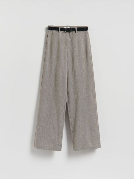 Spodnie z paskiem - brązowy. Brązowe spodnie materiałowe damskie Reserved, l, bez wzorów, z dzianiny. Za 129.99 zł.