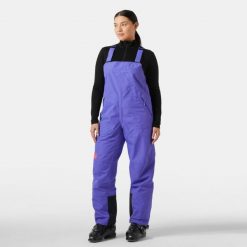Damski kombinezon narciarski Helly Hansen Emiko Shell Bib. Fioletowe spodnie snowboardowe damskie Helly Hansen, na zimę, bez wzorów, sportowe, narciarskie. W wyprzedaży za 958.00 zł.