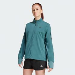 Kurtka do biegania Own the Run Winterized. Niebieskie kurtki sportowe damskie Adidas, m, bez wzorów, bez kaptura, do biegania, climawarm (adidas). Za 439.00 zł.