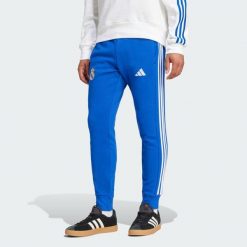 Spodnie Real Madrid DNA. Niebieskie spodnie sportowe męskie Adidas, xs, bez wzorów, z dresówki, do piłki nożnej. Za 300.00 zł.