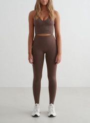 Damskie legginsy bezszwowe, wysoki stan, squat proof petite Shape brąz macchiato. Brązowe legginsy damskie Aim'n, xl, bez wzorów, z elastanu, z podwyższonym stanem, na fitness i siłownię. Za 296.00 zł.
