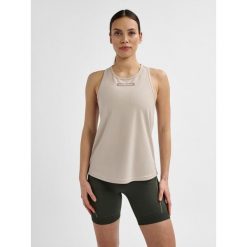 Damski tank top Hummel TE Tola. Szare koszulki sportowe damskie Hummel, m, bez wzorów, z materiału, sportowe, bez kołnierzyka. Za 126.50 zł.