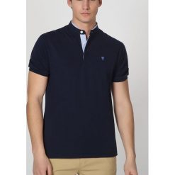 Koszulka polo w kolorze granatowym. T-shirty dla chłopców The Time of Bocha, z krótkim rękawem. W wyprzedaży za 94.95 zł.