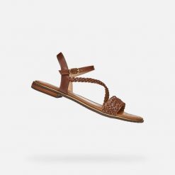 Sandały GEOX D55DQD Brązowy. Brązowe sandały damskie Geox, bez wzorów, ze skóry, bez obcasa, bez zapięcia. Za 331.99 zł.