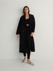 Legginsy z metalicznym efektem - czarny. Czarne legginsy damskie Reserved, l, bez wzorów, z dzianiny. W wyprzedaży za 39.99 zł.