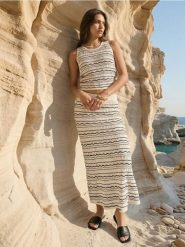 Bawełniana swetrowa spódnica midi - wielobarwny. Spódnice damskie Sinsay, l, bez wzorów, z bawełny, midi. Za 59.99 zł.