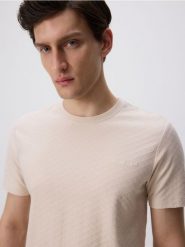 Strukturalny t-shirt slim - kremowy. Białe t-shirty męskie Reserved, l, bez wzorów, z bawełny, bez kołnierzyka. Za 69.99 zł.