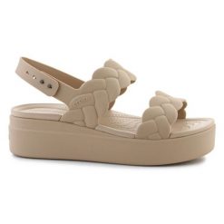 Sandały Crocs Brooklyn Woven Low Wedge 209977-212 beżowy. Brązowe sandały damskie bez wzorów, bez obcasa, na koturnie, bez zapięcia. Za 367.32 zł.