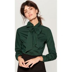 Koszula z wiązaniem na dekolcie - Khaki. Koszule damskie marki SOLOGNAC. W wyprzedaży za 49.99 zł.