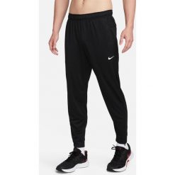 Spodnie sportowe damskie Nike Totality. Czarne spodnie dresowe damskie Nike, l, bez wzorów, z dresówki, do biegania. Za 257.75 zł.