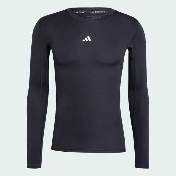 Koszulka TECHFIT Compression Training Long Sleeve. Czarne koszulki sportowe męskie Adidas, l, bez wzorów, z dzianiny, bez kołnierzyka, bez ramiączek, na fitness i siłownię, techfit (adidas). Za 179.00 zł.