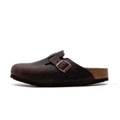 Kapcie Birkenstock Boston Damskie. Brązowe kapcie damskie Birkenstock, bez wzorów, z materiału. Za 638.05 zł.
