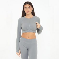 Koszulka Crop Top treningowa IMALA długie rękawy. Szare koszulki sportowe damskie Legea, bez wzorów, z elastanu, bez kołnierzyka, bez ramiączek, na fitness i siłownię. W wyprzedaży za 95.50 zł.