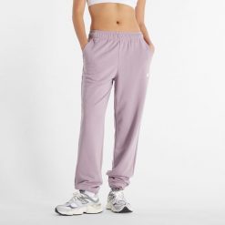 Spodnie damskie New Balance WP41500ICW – różowe. Czerwone spodnie dresowe damskie New Balance, xl, bez wzorów, z bawełny. Za 129.99 zł.