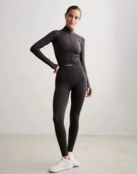 Damskie legginsy dłuższe, wysoki stan, invisible scrunch Shape Seamless szare. Szare legginsy damskie Aim'n, xs, bez wzorów, z dzianiny. Za 301.00 zł.