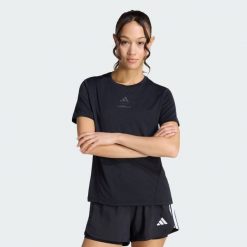 Koszulka Les Mills Graphic. Czarne koszulki sportowe damskie Adidas, bez wzorów, na fitness i siłownię. Za 199.00 zł.