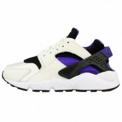 Buty do chodzenia damskie Nike Air Huarache. Białe obuwie sportowe damskie Nike, bez wzorów, z gumy, do biegania. Za 510.45 zł.